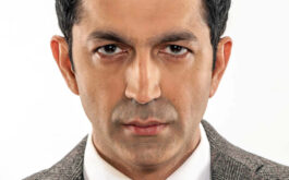 Kunal Kohli wearing a suit and tie